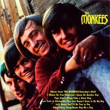 The Monkees debut LP, 1966: For years I thought the boys were leaning over an arched bridge. Then I saw the complete photo somewhere, which showed this bridge to actually be Davy's tweed-pants-ed leg!