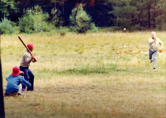 My dad throws batting practice to my brother Chris (batting) and me (catching) one of countless times we played until dusk forced us inside, circa 1976-77.