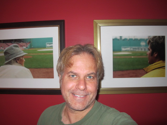 Me beside two photographs my brother Chris took of my dad and me at Fenway Park on May 24, 2003. Chris gave these to me, blown up and framed, for my birthday.
