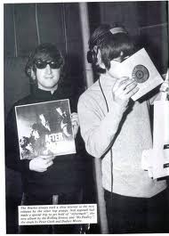 The Beatles' John Lennon and Paul McCartney check out the Rolling Stones' latest, "Aftermath," in 1966, which came hot on the heels of the Beatles' "Rubber Soul." They'd follow it up with "Revolver."